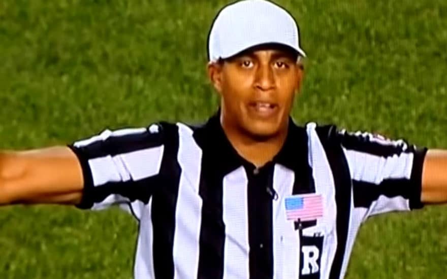 football referee making no good hand signal