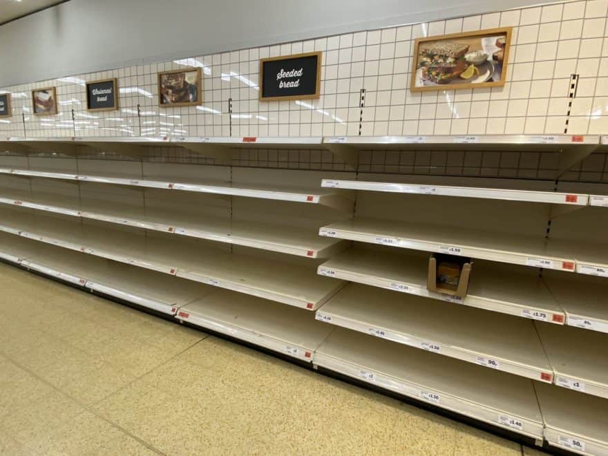 empty grocery store shelves from panic buying during coronavirus pandemic