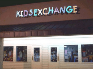 This logo for a kids' clothing exchange appears to say something else