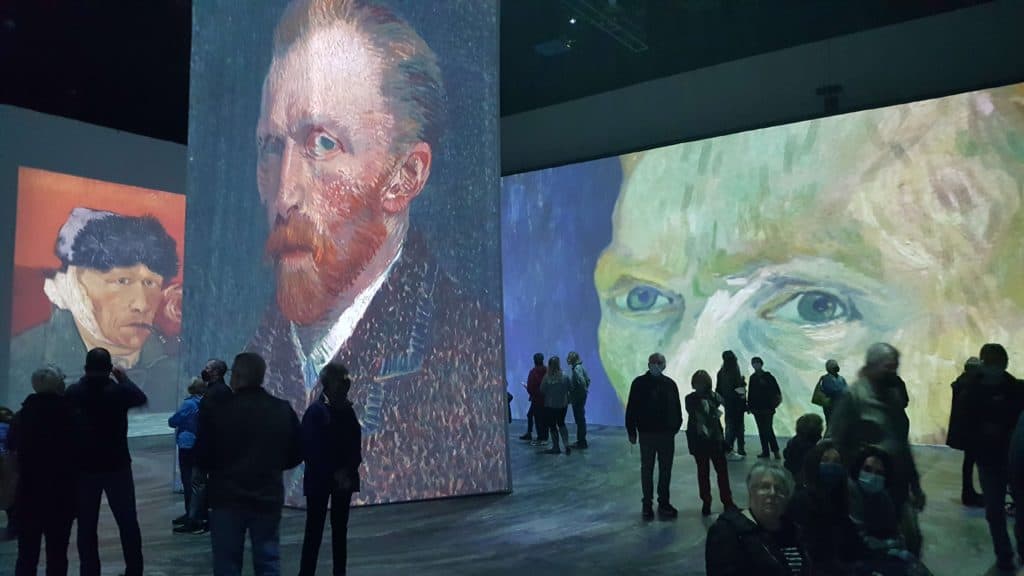 van gogh portraits projected on giant screens