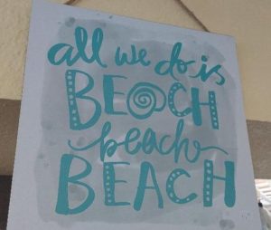 A beachy sign that says all we do is beach beach beach