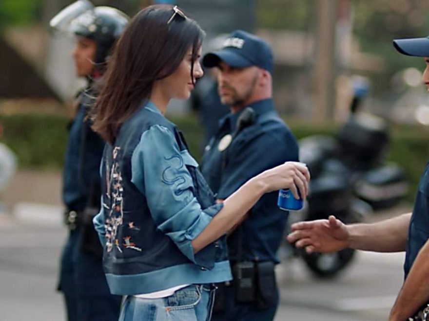 Frame from Pepsi's controversial TV commercial showing Kendall Jenner giving a Pepsi to a police officer at a Black Lives Matter protest