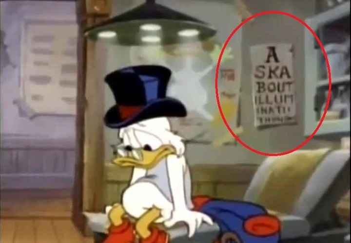 A scene from Disney's Duck Tales in which Scrooge visits the optometrist with an eye chart that says Ask About the Illuminati