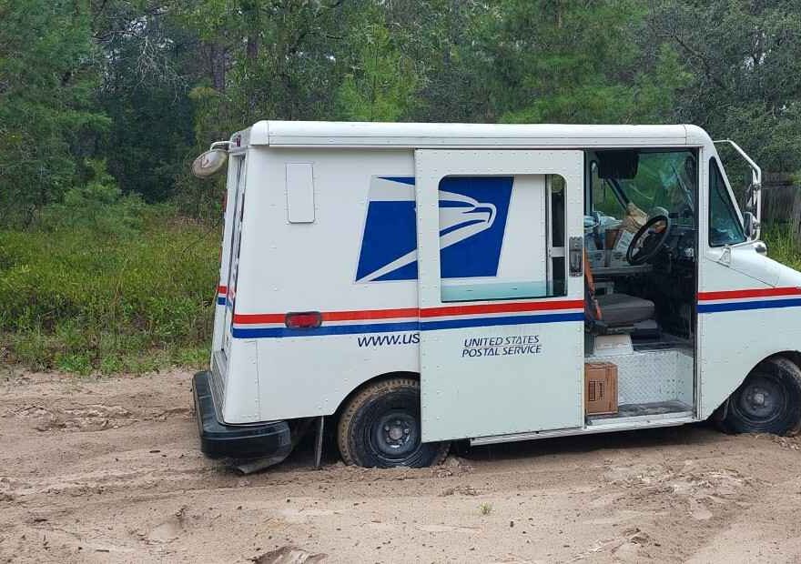 My USPS mail truck stuck on a pig trail in a very rural area